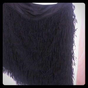 Torrid slimming a line fringe skirt.